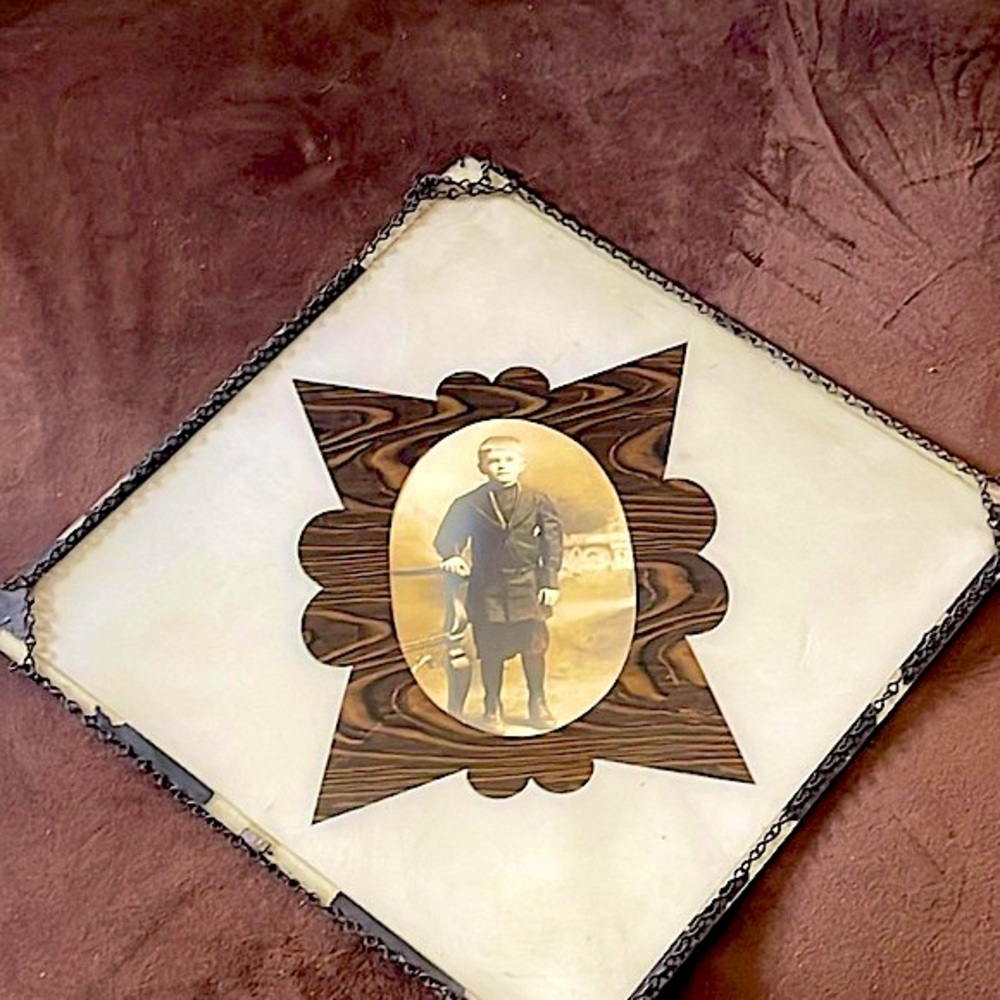 Antique,Turn of the Century, unknown identity. Chain framed. Inlaid glass pic.